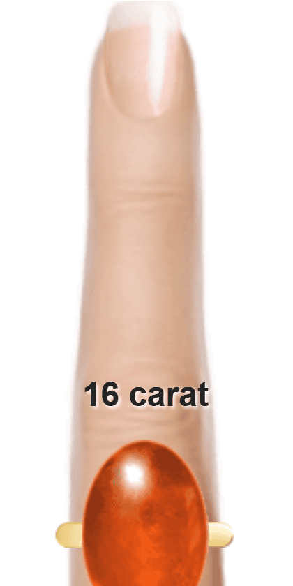 Orangey Red 16 carat cabochon-cut Sunstone on a ring and finger.