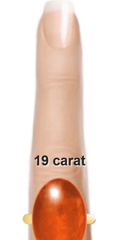 Orangey Red 19 carat cabochon-cut Sunstone on a ring and finger.