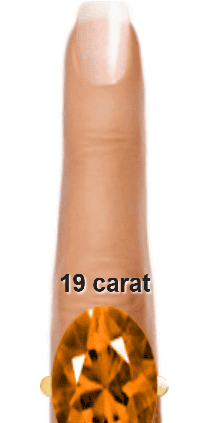 Orange 19 carat oval-cut Andesine on a ring and finger.