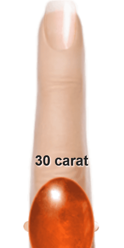 Orangey Red 30 carat cabochon-cut Sunstone on a ring and finger.