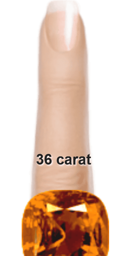 Orange 36 carat cushion-cut Beryl on a ring and finger.